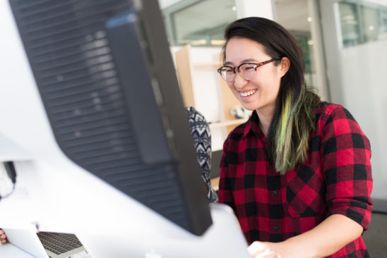 woman-smiling-on-computer