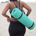 Woman Holding Yoga Mat